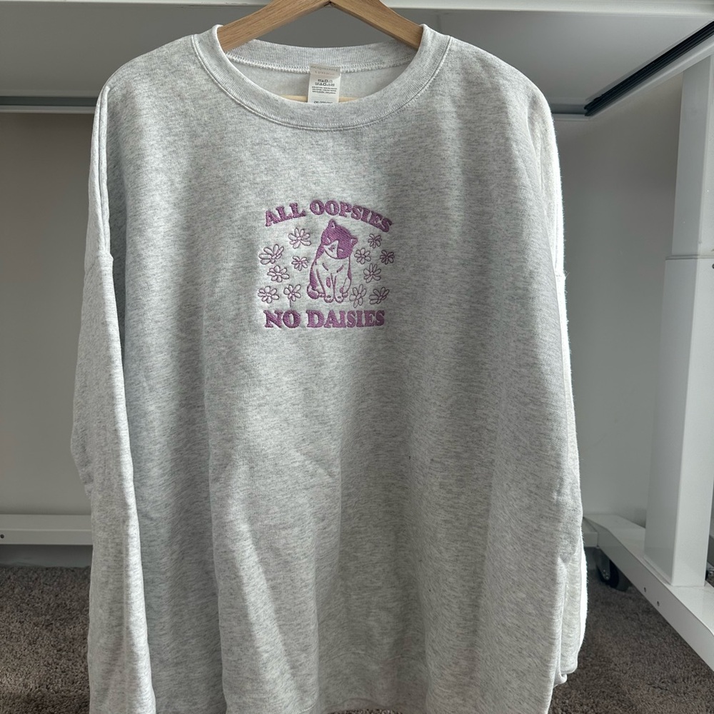 All Oopsies, No Daisies Gray Sweatshirt with Purple Embroidered Design